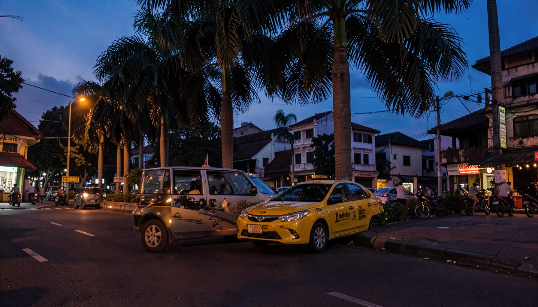 Quiet Chennai street at dusk with a sedan taxi parked near a row of palm trees, warm amber and deep blue tones